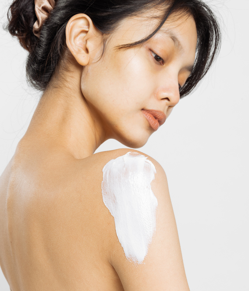 Portrait of a Woman with Lotion on Shoulder